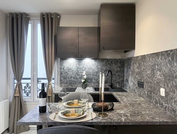 Fridge, microwave, stovetop, coffee/tea maker