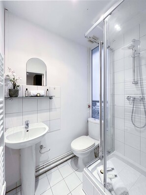 Shower, hair dryer, towels, soap