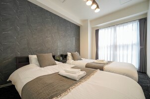 Suite familiar | 2 dormitorios, edredones de plumas, tabla de planchar con plancha