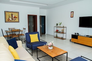 Comfort Apartment | Living area | 43-inch Smart TV with satellite channels