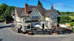 The Cricketers Inn, a traditional pub with outdoor seating and a signboard advertising a Cask Club. - The Cricketers Inn (Winchester)
