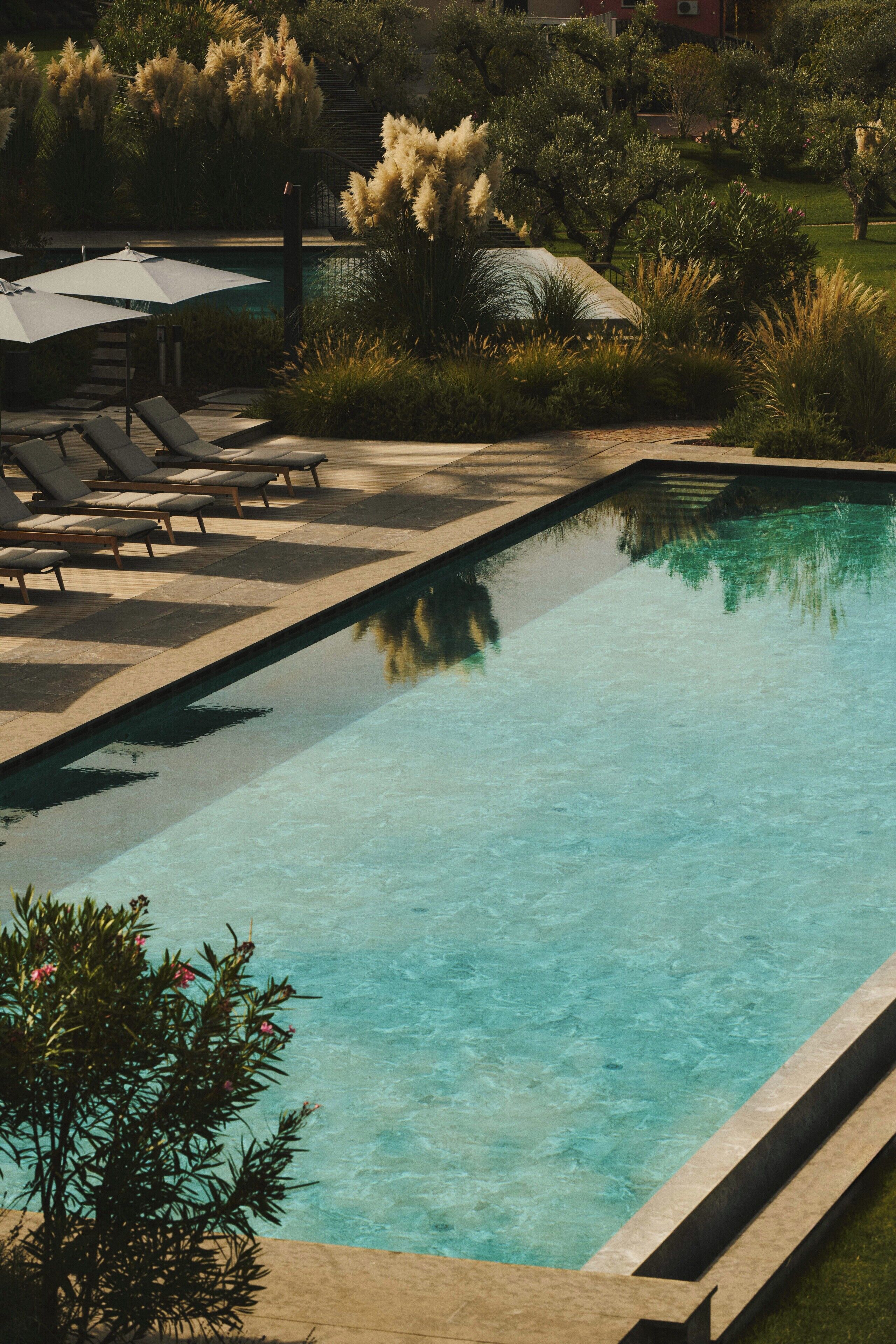 Indoor pool, outdoor pool, open 7:00 AM to 9:00 PM, pool umbrellas