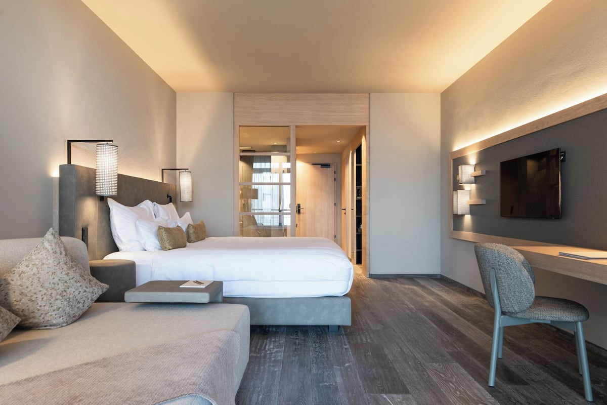 Junior Suite | 1 bedroom, premium bedding, down comforters, minibar