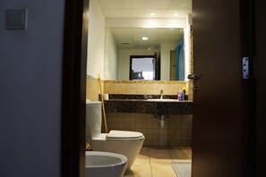 Bidet, soap, toilet paper