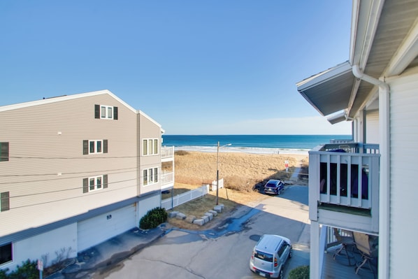 A residential building with a view of the beach and ocean. - Beachfront Old Orchard Beach Condo w/ Balcony (Old Orchard Beach)