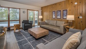 TV, fireplace - Chic Mid-Century Condo! Amazing Views! 2 Min Drive to Resort! (Big Sky)