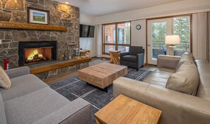 TV, fireplace - Chic Mid-Century Condo! Amazing Views! 2 Min Drive to Resort! (Big Sky)
