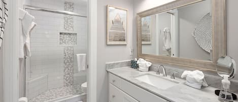 Regadera, toallas, papel de baño