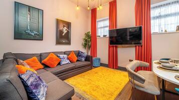 Apartment 207 - Two-bedrooms | Living area | Flat-screen TV