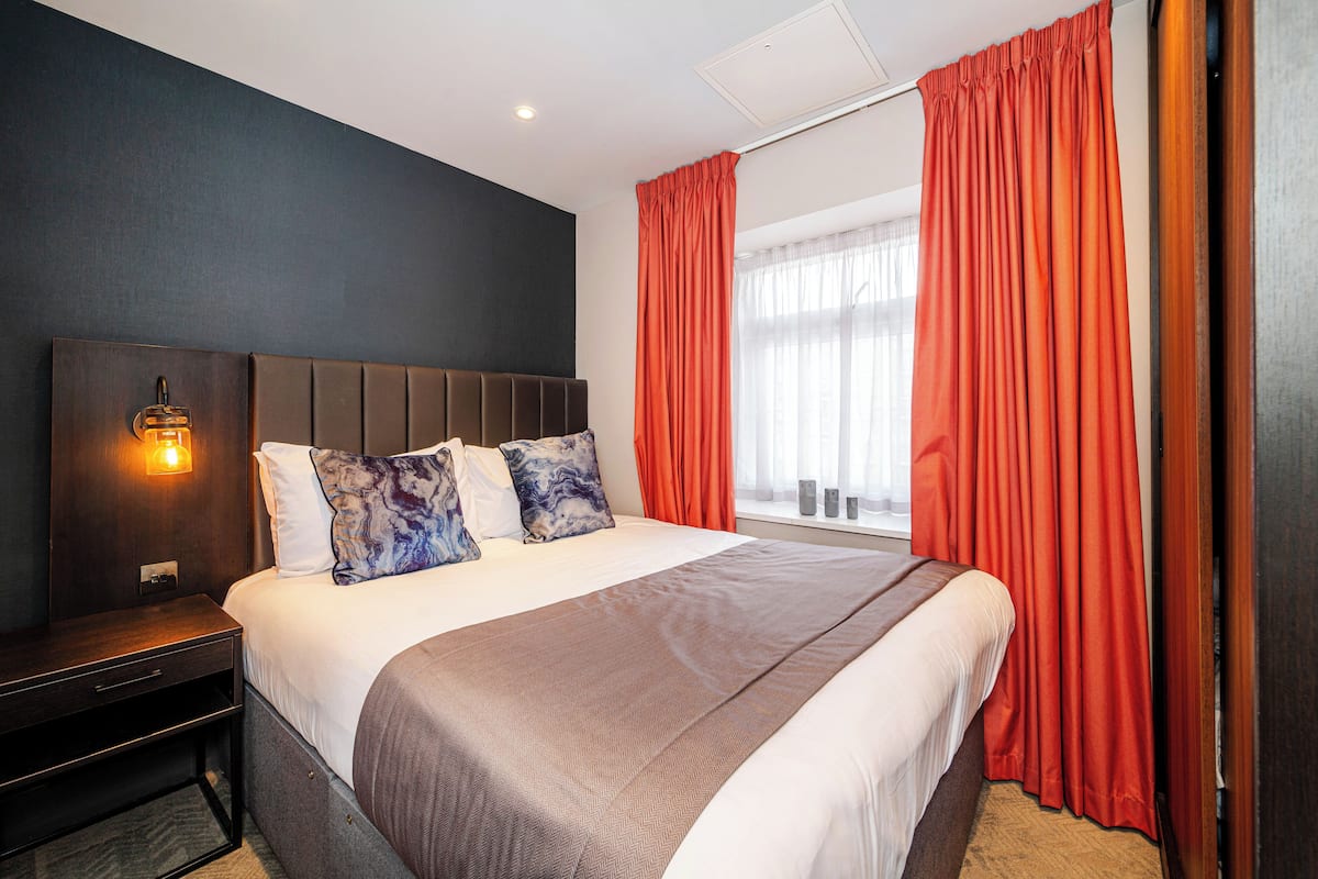 1 bedroom, blackout drapes, soundproofing, iron/ironing board