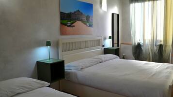 Superior Triple Room | Desk, blackout drapes, iron/ironing board, free WiFi