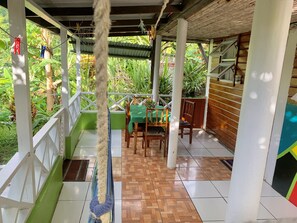 Outdoor dining -  Enjoy Dominica's tranquility, and local cuisine at Le Petit Paradis! (Roseau Valley)