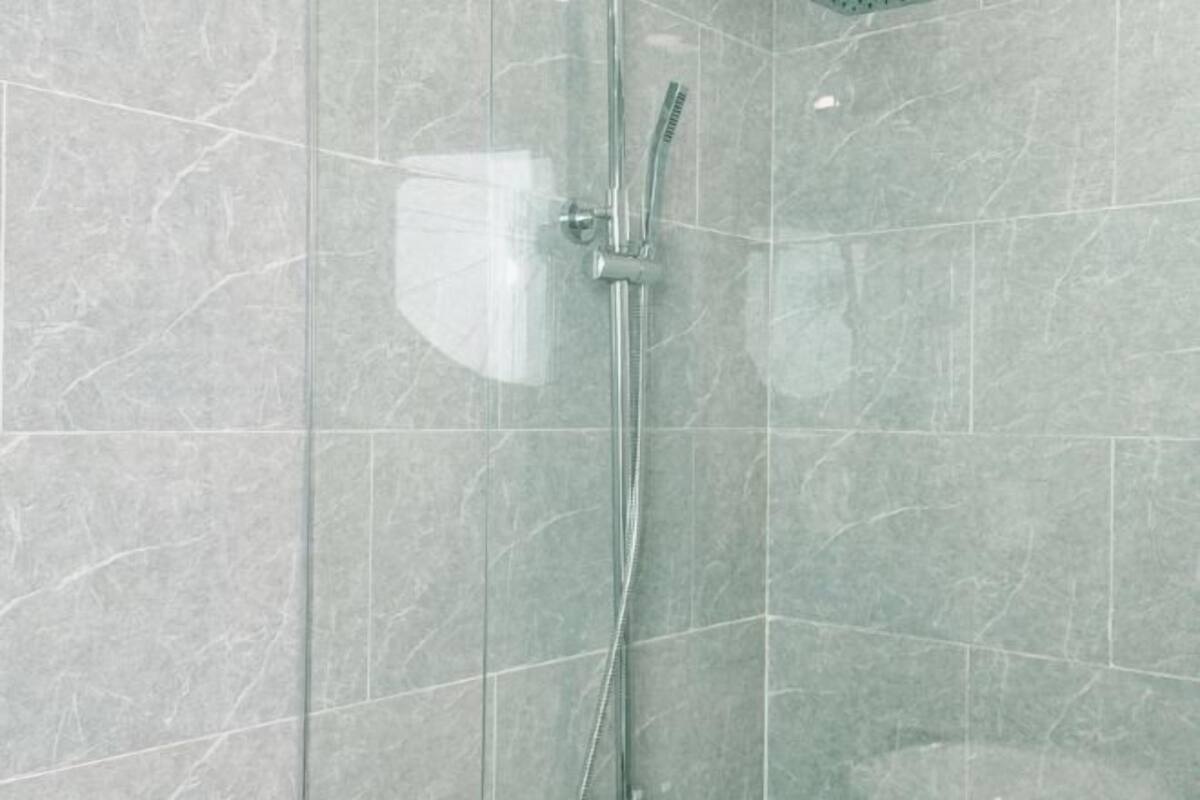 Bathroom | Shower, rainfall showerhead, eco-friendly toiletries, hair dryer