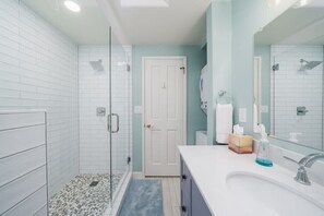 Shower, hair dryer, towels, soap
