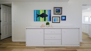 A white cabinet with three drawers and a small potted plant on top. - Luxury Gulf-Front Condo w/ Balcony Views | 3BR/2BA | Pool | Beach Access | Sleeps 6 | Great Sunsets | Anna Maria Island (Holmes Beach)