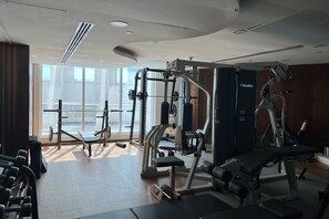 Stay fit on the go with a fully equipped gym featuring a range of exercise machines and free weights.
