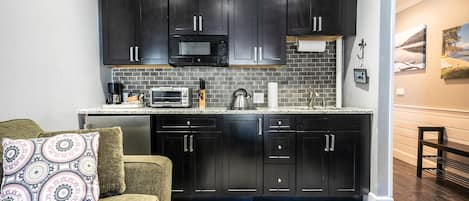 Fridge, microwave, stovetop, coffee/tea maker