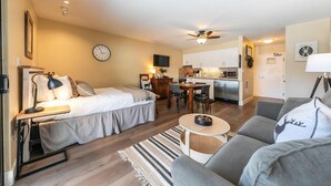 A compact living space with a bed, a sofa, a dining table, and a kitchenette. - Charming Deluxe Studio w/Lake View #246 at Donner Lake Village (Truckee)