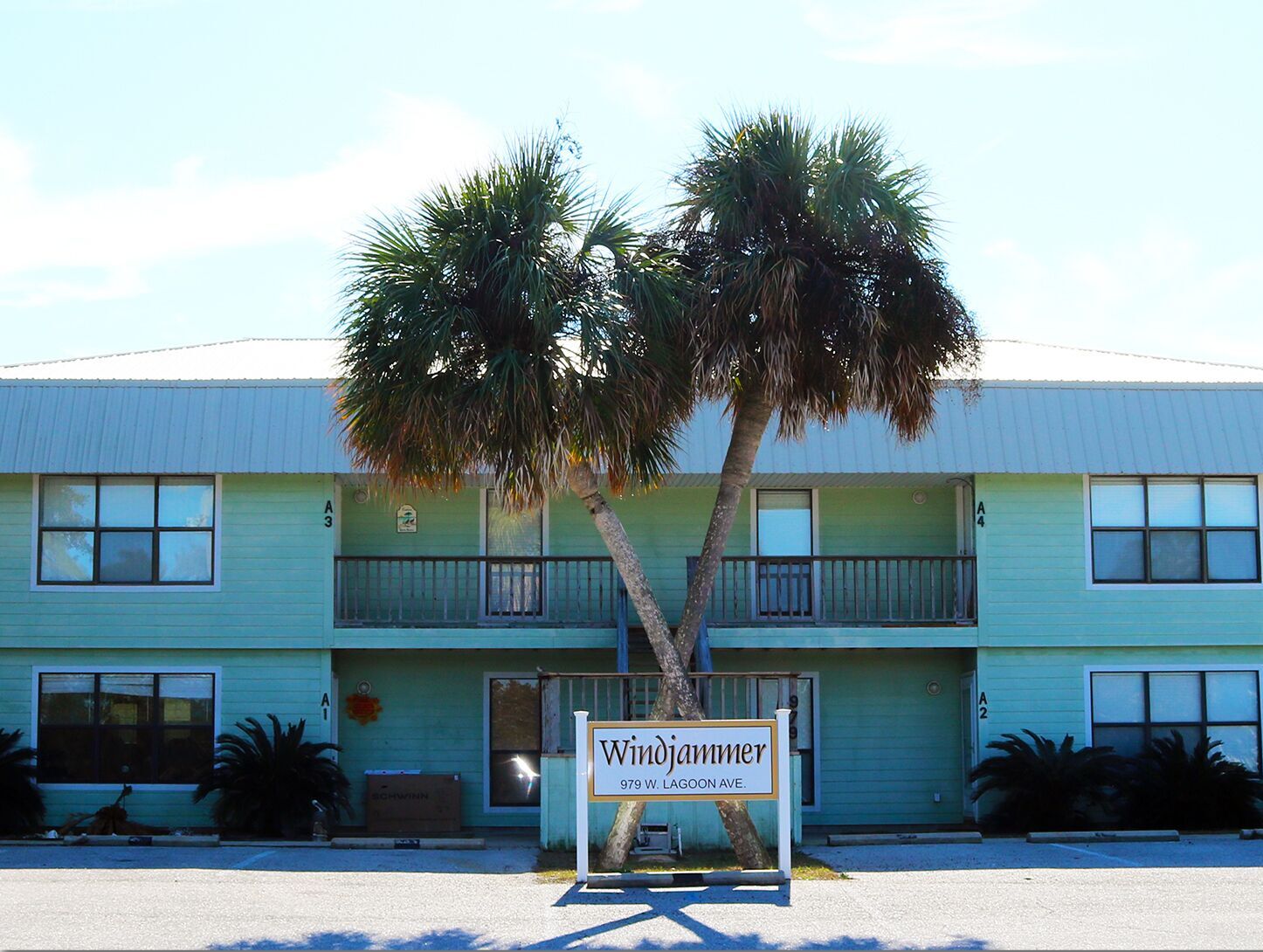 A two-story building with a sign in front reading "Windjammer 979 W. Lagoon Ave."