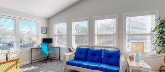 Island home with a shared pool, open layout, balcony, & AC - dog-friendly