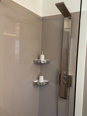 Shower, hair dryer, towels, soap