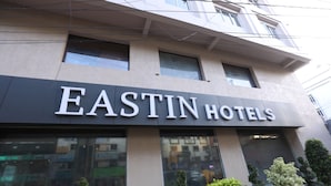 The EASTIN HOTELS building facade with large windows and a modern design. - Eastin Hotels (Hyderabad)