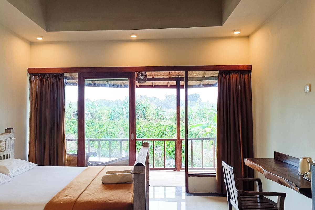 Casa de campo Deluxe, Terraza, vista al jardín | 1 habitación, escritorio, wifi gratis y ropa de cama