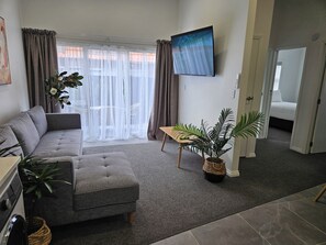 42-inch Smart TV with digital channels, Netflix, streaming services - Redwood Apartments (Rotorua)