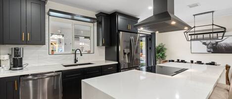 Fridge, stovetop, coffee/tea maker, cookware/dishes/utensils