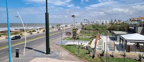 A coastal road with a McDonald's restaurant and a drive parking sign.