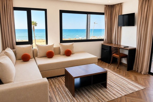 Deluxe Suite | Living area | 32-inch flat-screen TV with satellite channels, TV