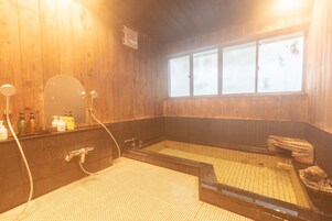 Designer toiletries, hair dryer, slippers, towels