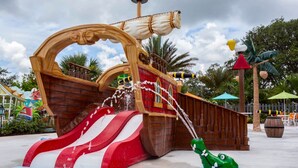 A pirate-themed water play area with a ship structure, a slide, and a crocodile-shaped water feature. - Cozy 3Bd Close to Disney Enclave 1021 (Davenport)