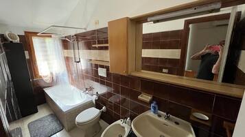 Bidet, towels, soap, toilet paper