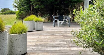 A shaped beach house located on the edge of Waratah Bay close Wilsons Promontory