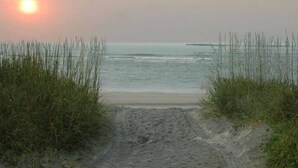 A beach path leading to the sea with tall grass on either side. - Yacht Club Villas #3-403 Spectacular Waterway View Condo! (North Myrtle Beach)