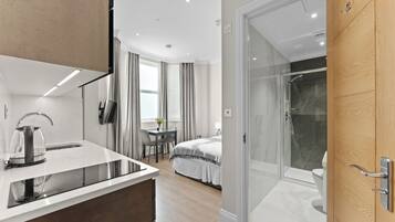 Garden View Deluxe Studio Suite | In-room safe, individually decorated, individually furnished