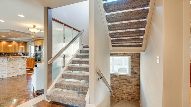 A spacious kitchen with wooden cabinets, a stone island, and modern appliances. - Expansive Mountain Gem: Game Room, 3 Mi to Acton (Acton)