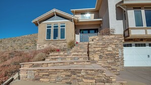 A two-story house with a stone staircase leading to the front door. - Expansive Mountain Gem: Game Room, 3 Mi to Acton (Acton)