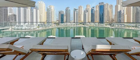 Outdoor pool, pool umbrellas, pool loungers