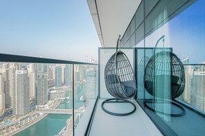 Elite Apartment, 3 Bedrooms, Balcony, Harbor View | Living area | 65-inch Smart TV with cable channels, Netflix, streaming services