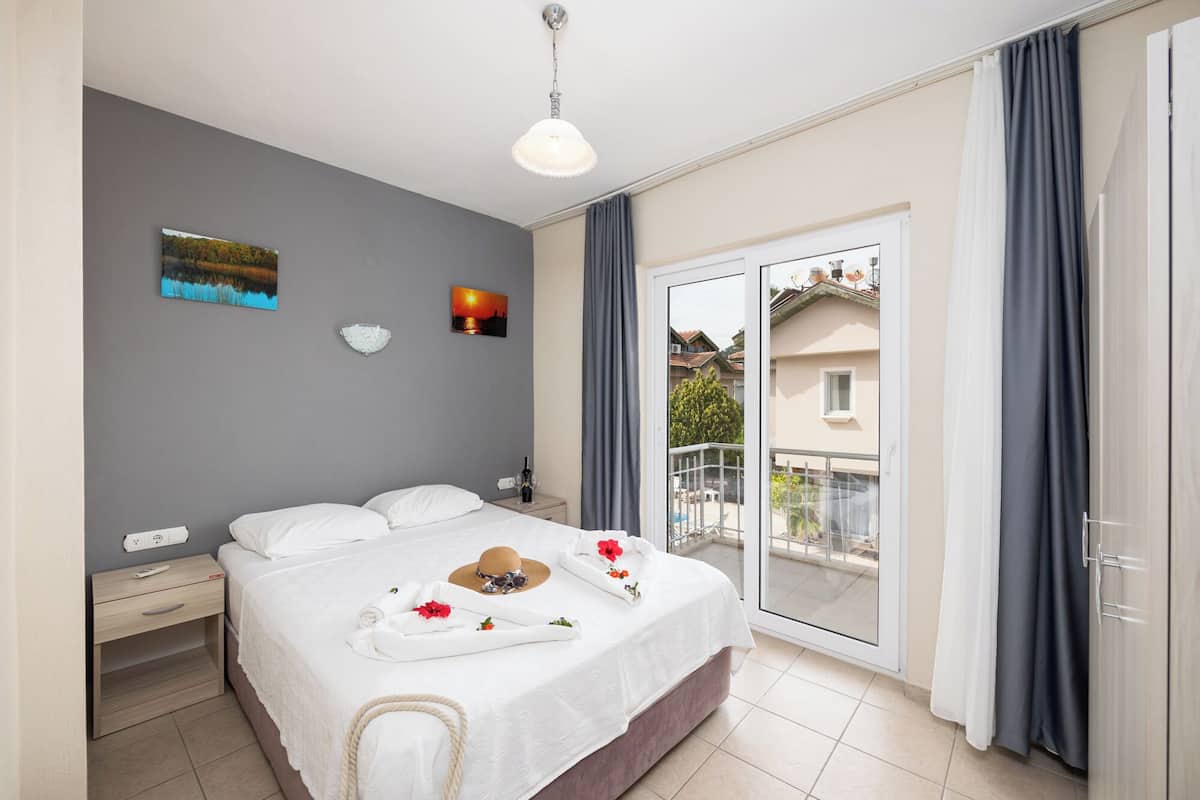 Family Room, 2 Bedrooms, Garden View | 2 bedrooms, bed sheets