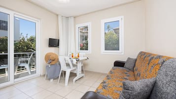 Family Room, 2 Bedrooms, Pool View | Living area | 75-cm flat-screen TV with satellite channels