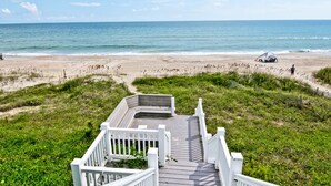 A wooden boardwalk leading to a beach with a clear view of the ocean. - Spindrift, Oceanfront House in Emerald Isle, NC! (Emerald Isle)