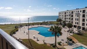 A hotel with a pool area, a view of the ocean, and a building with multiple floors. - Summer Winds A-415, Oceanfront Condo in Indian Beach, NC! (Indian Beach)
