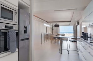 Coffee/tea maker, fridge, microwave, oven
