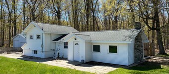 Cozy 3-bedroom cottage, large yard, minutes from Lake Michigan. Pet friendly.