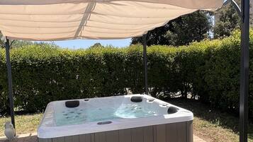 Seasonal outdoor pool, open 9:00 AM to 9:00 PM, pool umbrellas