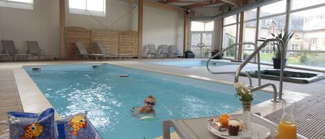 Indoor pool, open 10:00 AM to 6:00 PM, pool loungers