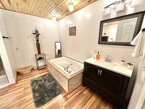 Jetted bath, hair dryer, towels, soap